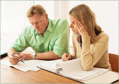 Two People Going Over Finances.