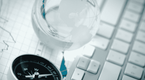 compass with a glass ball